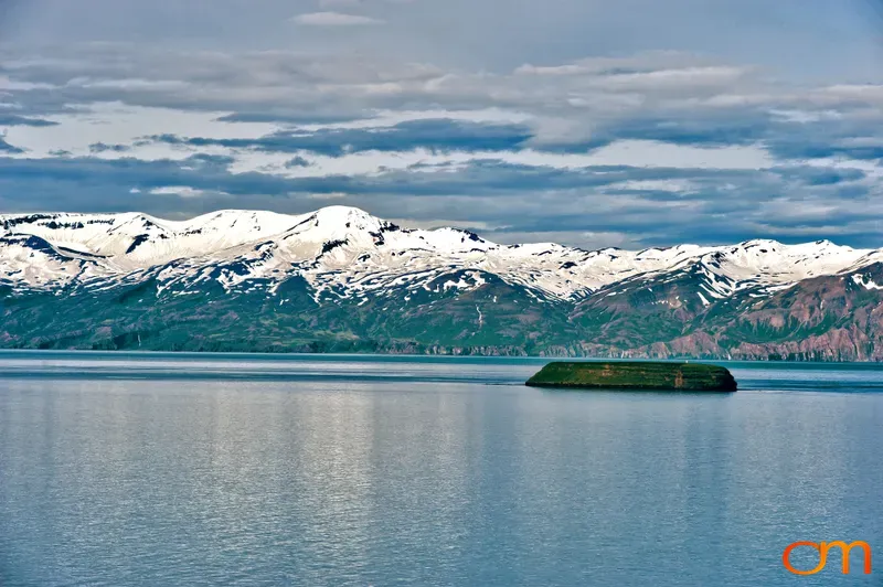 Icelandic Coastline with Snowy Mountains