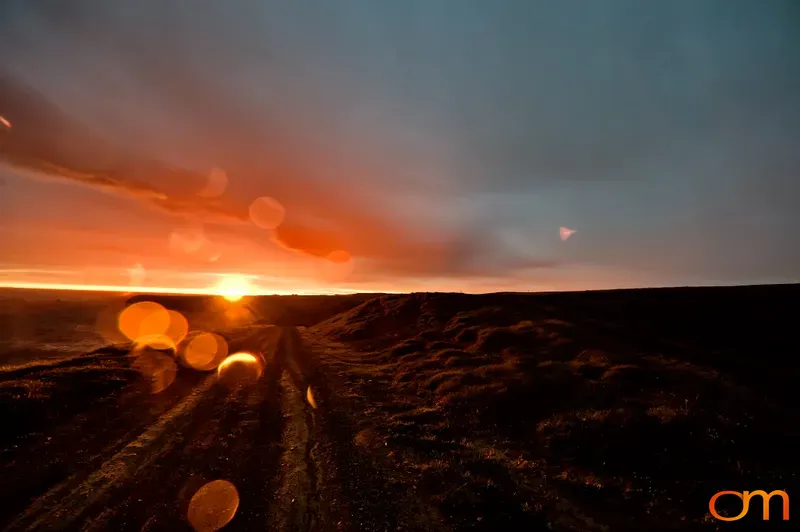 Midnight Sun Over Dirt Road