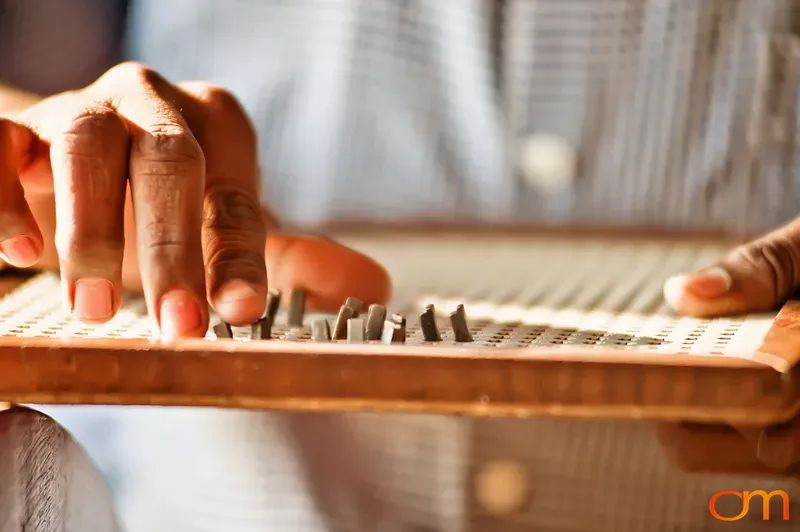 Hands Using Tactile Math Board for Blind Students