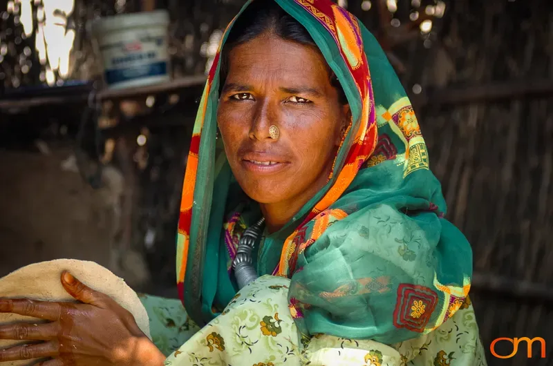 Portrait of Rural Indian Woman With Flatbread