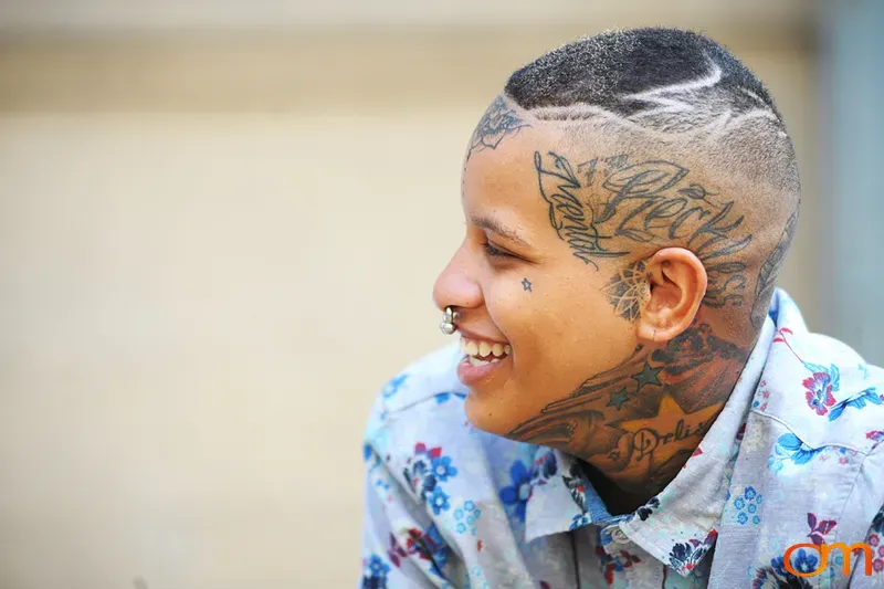 Side Portrait of Tattooed Woman with Facial Tattoos